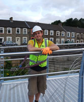 Jonny taking a break from rigging a footbridge